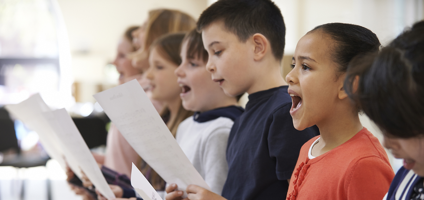 children singing with music